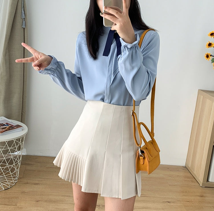 Pleated mini 2024 skirt tan